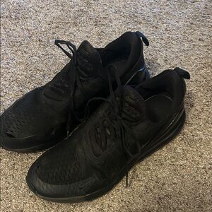 Nike Air Max 270 sneakers in the "Triple Black" colorway.